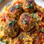 Delightful Baked Rosemary Chicken Meatballs with Tomato Orzo First Image First Image