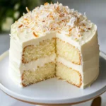 White Chocolate Coconut Cake: A Soft, Moist Coconut Dessert with White Chocolate Filling First Image First Image