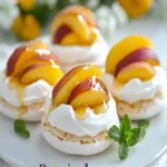 Mini Pavlovas With Poached Peaches for a Perfect Summer Treat First Image First Image