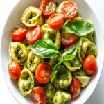 Delicious Pesto Tortellini Salad with Fresh Cherry Tomatoes First Image First Image